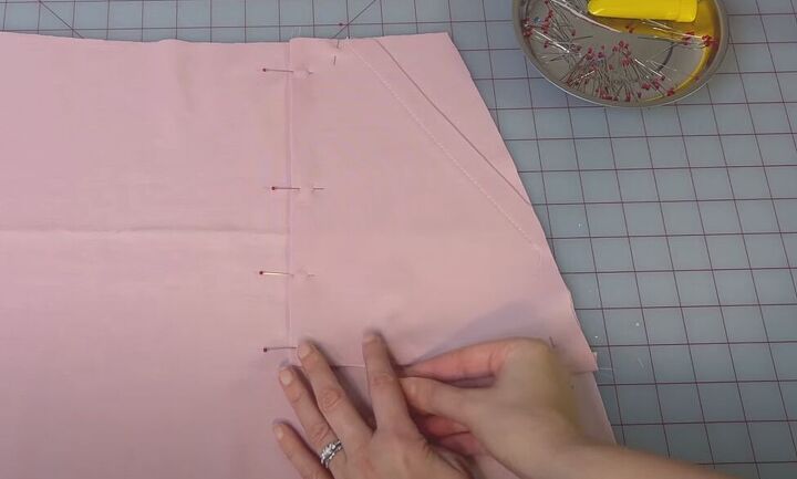 how to make a cute a line mini with the rose miniskirt sewing pattern, Pinning the pockets to the skirt pattern