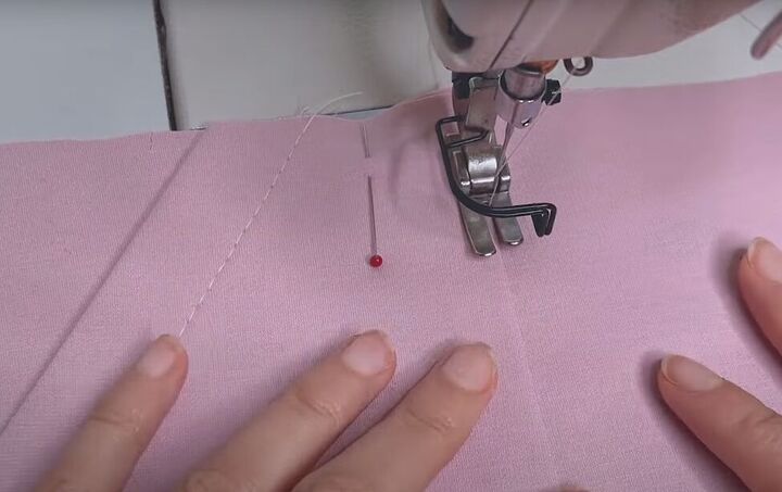how to make a cute a line mini with the rose miniskirt sewing pattern, Topstitching the pockets to the skirt