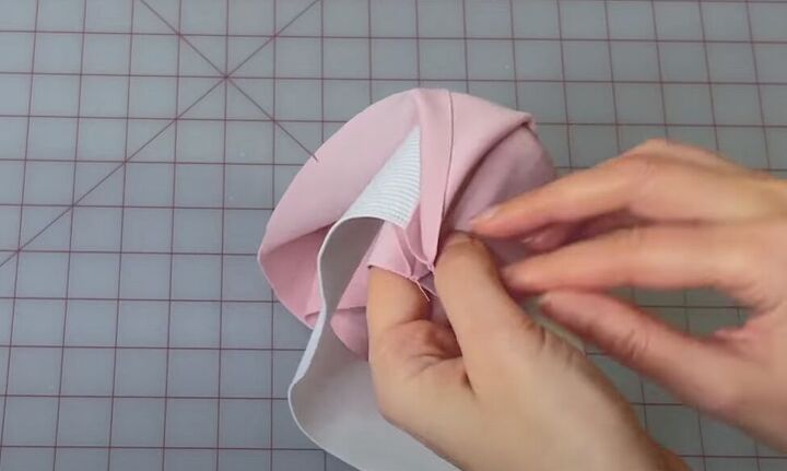 how to make a cute a line mini with the rose miniskirt sewing pattern, Folding and pinning the waistband in half with the elastic