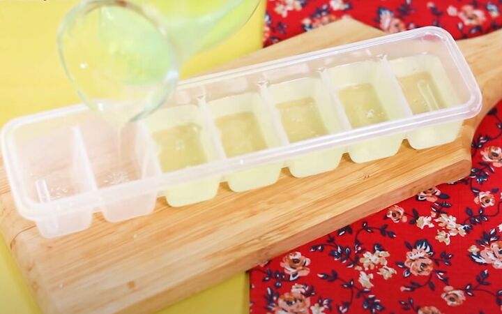 how to make soothing diy ice cubes for your face 4 easy recipes, Pouring the aloe mixture into an ice cube tray