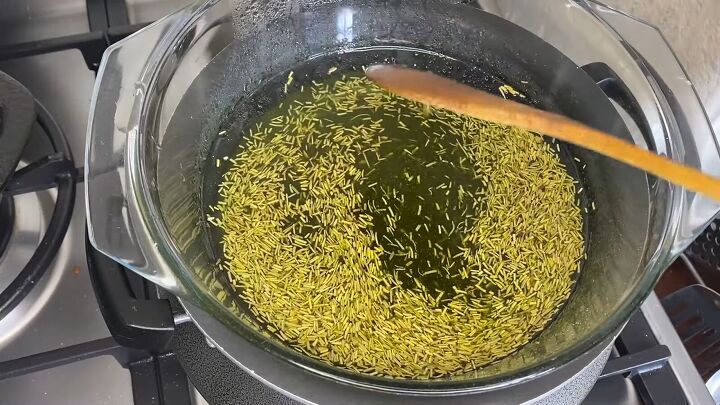powerful diy hair growth oil with avocado oil rosemary moringa, Heating the ingredients in a double boiler