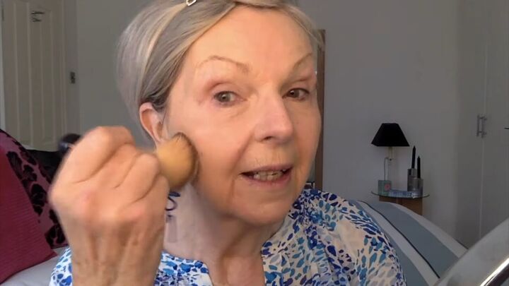 how to do soft summer makeup for mature skin 8 summer essentials, Applying translucent powder with a brush