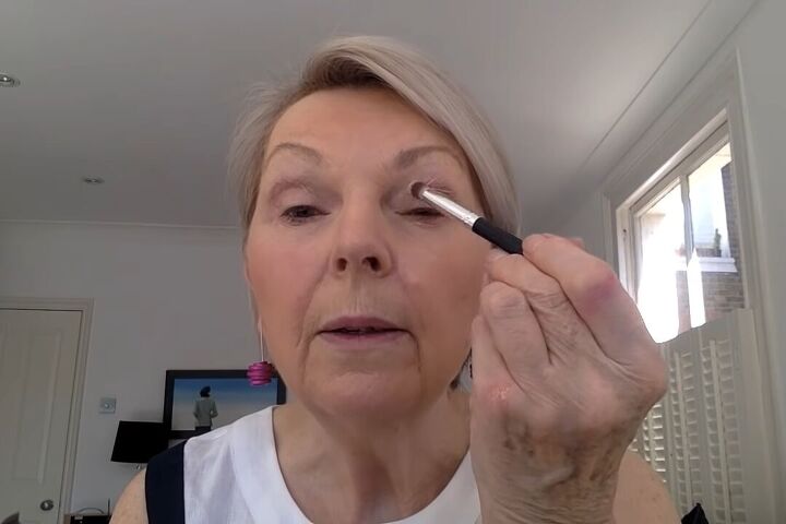 how to do light summer eye makeup over 60 in 8 simple steps, Applying a cream color eyeshadow