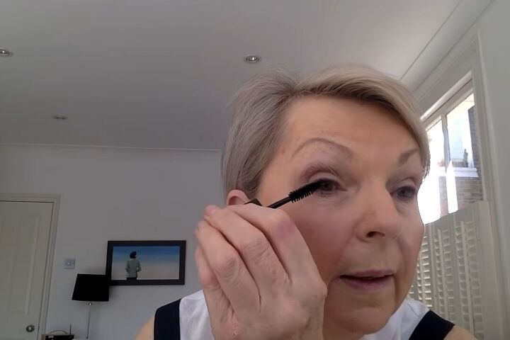 how to do light summer eye makeup over 60 in 8 simple steps, Applying mascara to the lashes