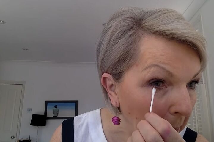 how to do light summer eye makeup over 60 in 8 simple steps, Cleaning up eye makeup with a q tip