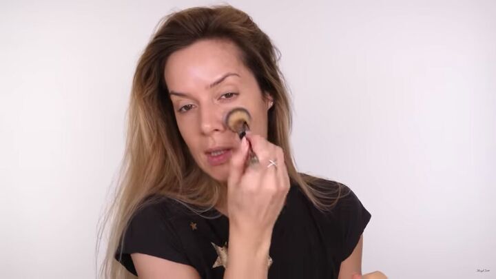 how to do a classic brown gold eyeshadow look that suits everyone, Buffing foundation with a makeup brush