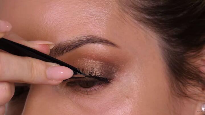how to do a classic brown gold eyeshadow look that suits everyone, Applying false lashes with tweezers