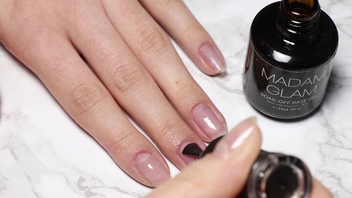 how to do glam dita von teese nails with a red half moon manicure, Applying a base layer of gel polish