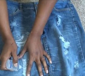 how to cut distress jean shorts ready for the summer, Applying fray check to the edges