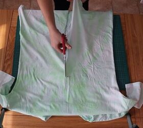 how to make a wrap top out of a t shirt in 5 simple steps, Cutting down the middle of the t shirt