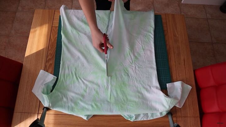 how to make a wrap top out of a t shirt in 5 simple steps, Cutting down the middle of the t shirt