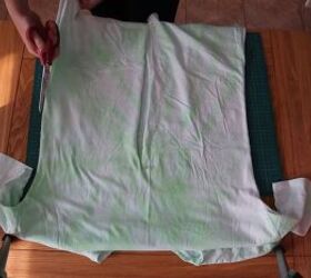 how to make a wrap top out of a t shirt in 5 simple steps, Cutting the side seams of the t shirt