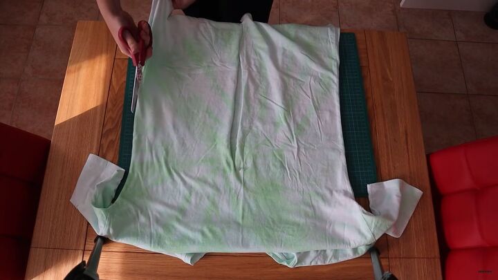 how to make a wrap top out of a t shirt in 5 simple steps, Cutting the side seams of the t shirt