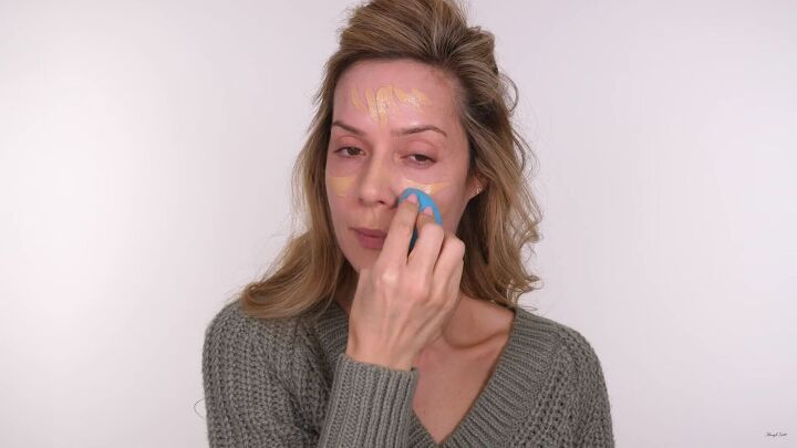 fuss free makeup for beginners how to do an easy glam look, Blending the foundation with a damp makeup sponge