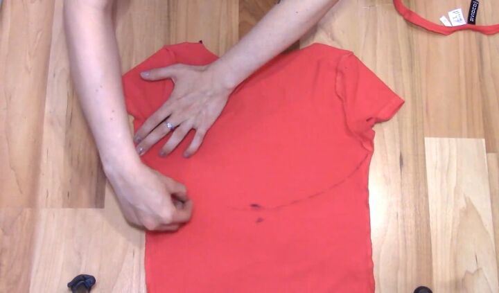 how to cut t shirts into tank tops halter tops in a few easy steps, Drawing a curved line at the back