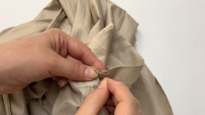 how to sew paperbag waist pants with pockets using a free pattern, Folding the excess seam