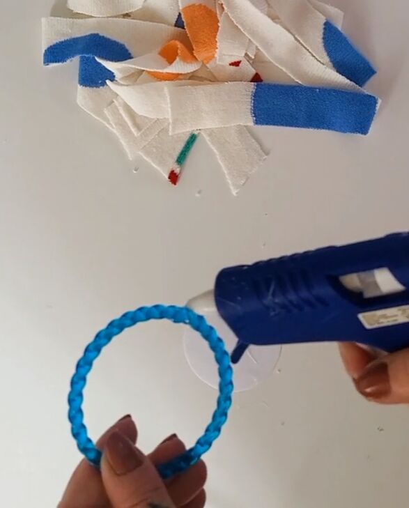 how to repurpose a shrunken sweater into 4 fun accessories, Using a hot glue gun
