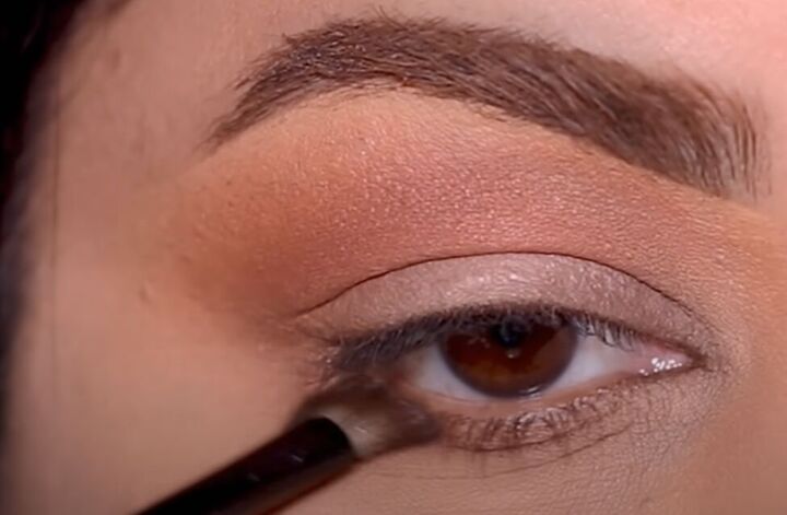 how to fix patchy eyeshadow tips for getting perfect eye makeup, Using a small angled makeup brush