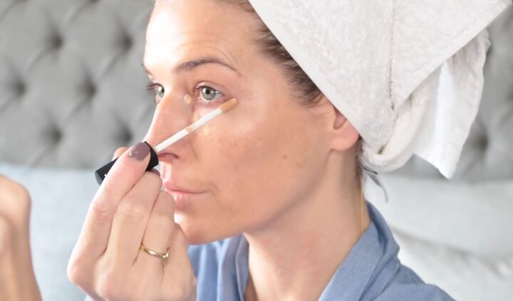 beauty routine over 40 how to get a natural glowing look, Applying concealer under the eyes