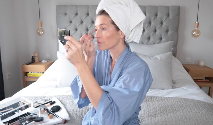 beauty routine over 40 how to get a natural glowing look, Applying a white tone eyeshadow