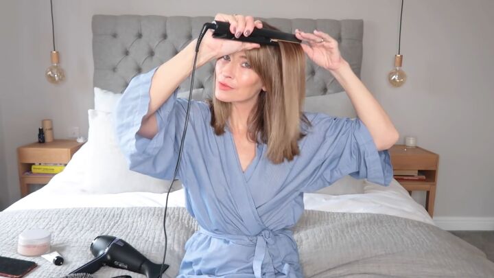 beauty routine over 40 how to get a natural glowing look, Straightening hair with a flat iron
