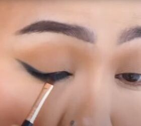 date night makeup how to create a soft glamorous look for a date, Applying the creamy eyeliner to the upper lash line with a brush