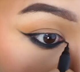 date night makeup how to create a soft glamorous look for a date, Using a fine tipped eyeliner to extend the line to the inner corners