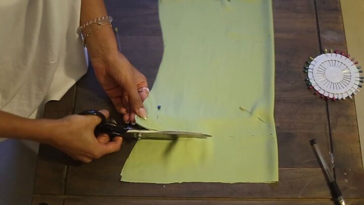 how to sew a cowl neck top that s essential for your summer wardrobe, Pinning satin before cutting