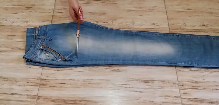 how to make diy lace up shorts without eyelets in just 10 minutes, Cutting the jeans into shorts