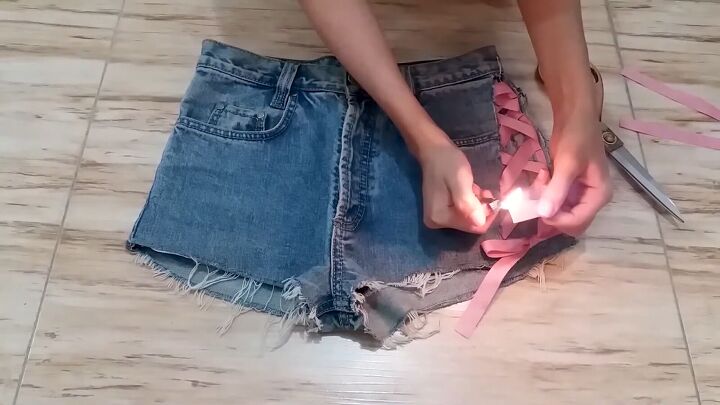 how to make diy lace up shorts without eyelets in just 10 minutes, Tying the ribbon ends in a bow