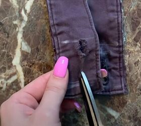 how to easily make a cute diy overall dress out of old pants, Cutting buttonholes in the straps