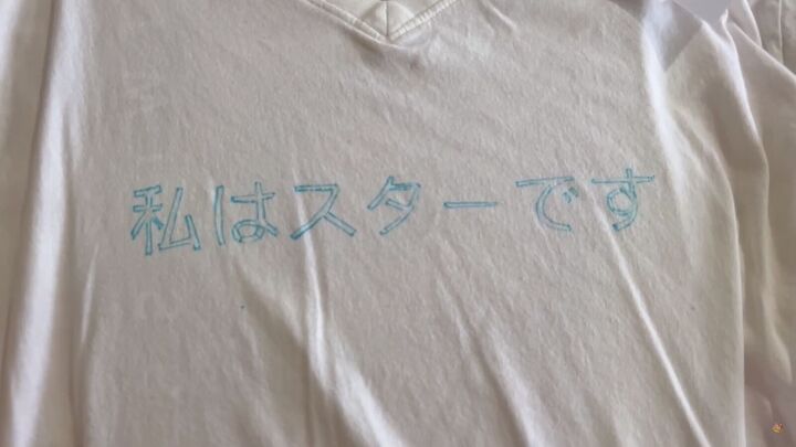 how to embroider a t shirt with a quote in 3 simple steps, Using the stencil to write out the quote