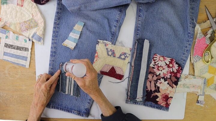 how to make cute patchwork jeans out of old fabric scraps, Gluing the patches to the jeans with fabric glue