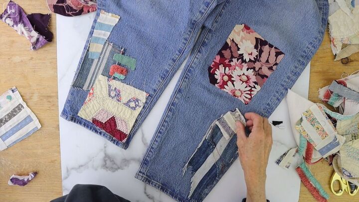 how to make cute patchwork jeans out of old fabric scraps, Using fabric scraps to make patchwork jeans