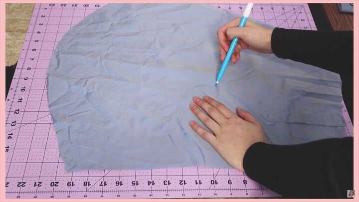 how to make a skirt out of a shirt in 7 simple steps, Tracing around a hand to make pockets