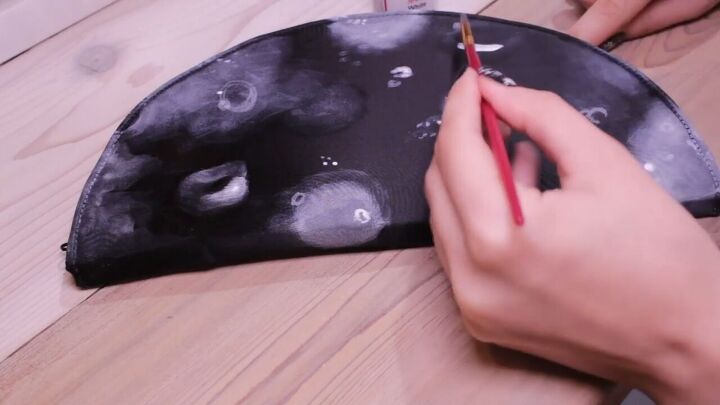 diy clutch painting how to make a glittering half moon design, Adding detail with a smaller brush