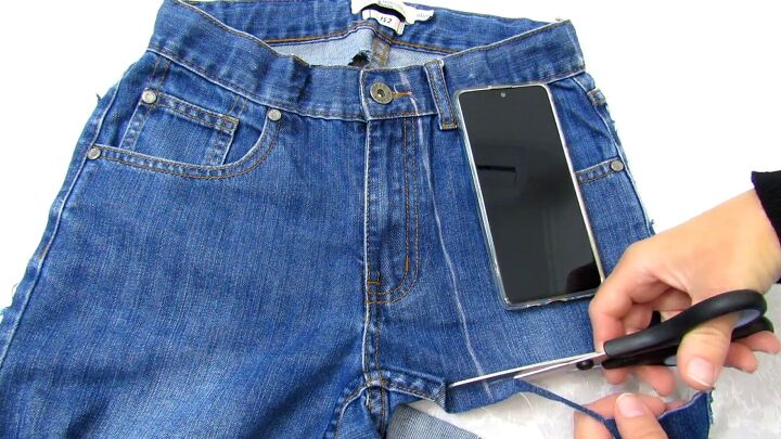 how to make a cute diy cell phone bag out of jean pockets, Cutting the shape for the phone bag