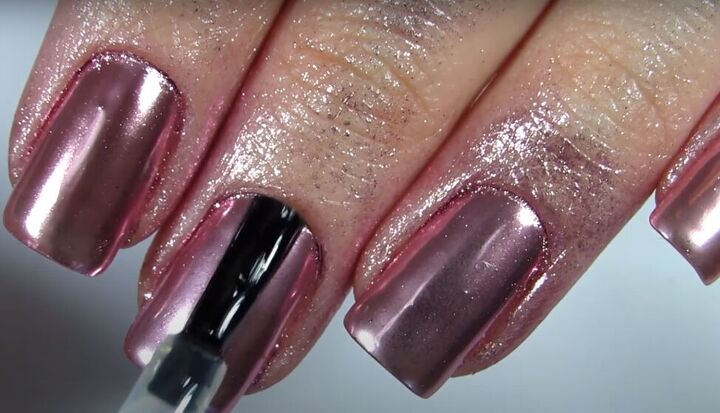 how to easily do rose gold chrome nails with powder instead of polish, Applying a no wipe top coat to the rose gold chrome nails