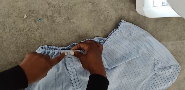 how to cut a shirt into a crop top with a cute off shoulder design, Closing the opening