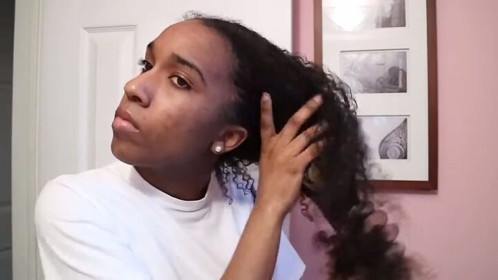how to easily do a chic sleek low bun on natural hair, Applying leave in conditioner to hair