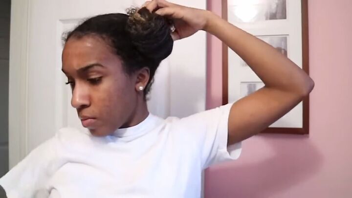 how to easily do a chic sleek low bun on natural hair, Twisting and curling hair into a bun