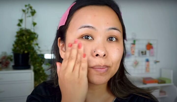 light fresh no foundation makeup look that s perfect for summer, Patting on vitamin C serum