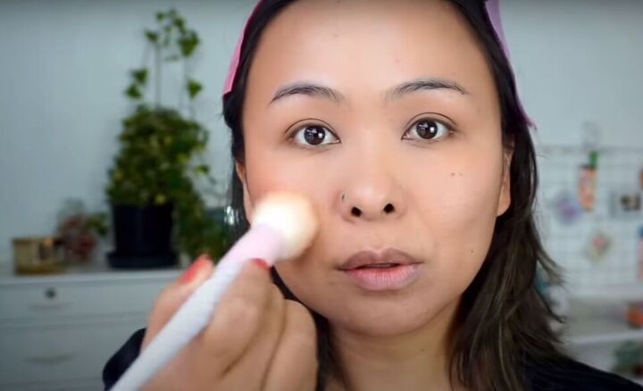light fresh no foundation makeup look that s perfect for summer, Applying peachy blush to cheeks