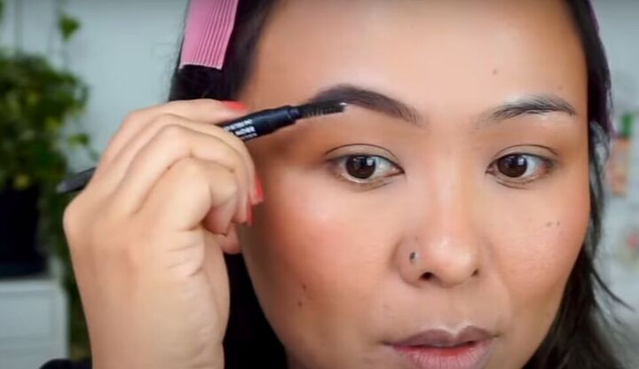 light fresh no foundation makeup look that s perfect for summer, Filling in brows with brow pencil