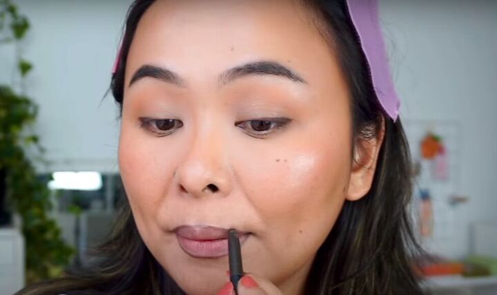 light fresh no foundation makeup look that s perfect for summer, Using brow pencil as lip liner