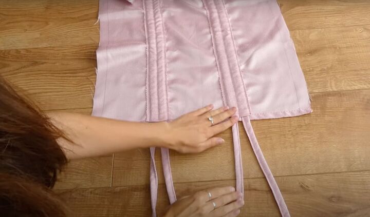 how to sew a dreamy diy ruffle dress out of old curtains, Feeding them strips back out the other side