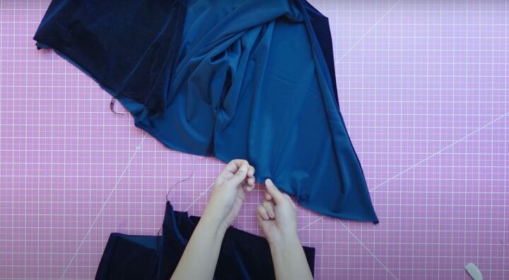 how to sew a cute velvet dress with a wrap top long flowy skirt, Pulling on the threads to gather the fabric