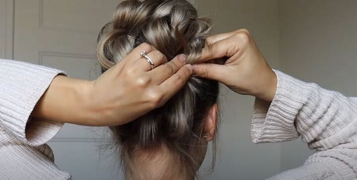 how to do a high bun wedding hair updo in 7 easy steps, Wrapping hair around the finger and pinning it