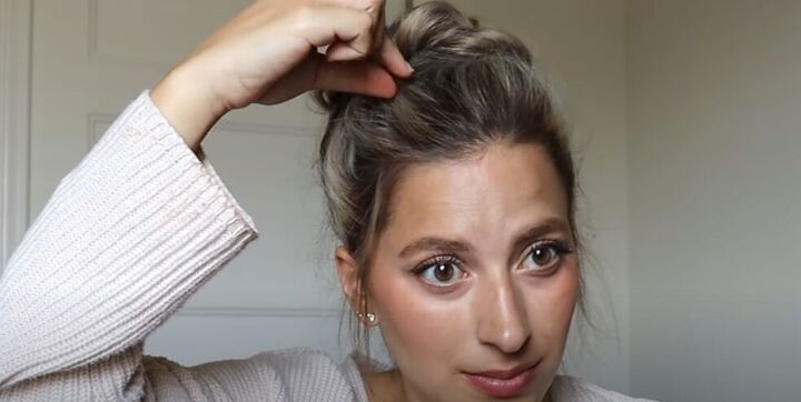 how to do a high bun wedding hair updo in 7 easy steps, Pinching and pulling the hair for volume