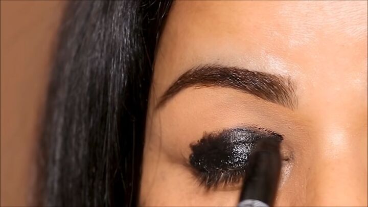 how to do a glam black smokey eye with glitter without making a mess, Applying a stick eyeshadow base